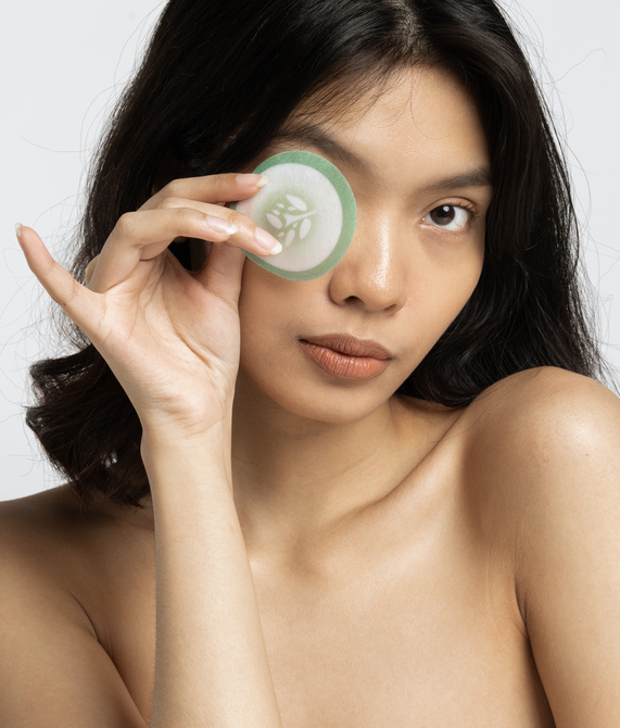 Portrait of Woman Covering Her Eye with Beauty Product